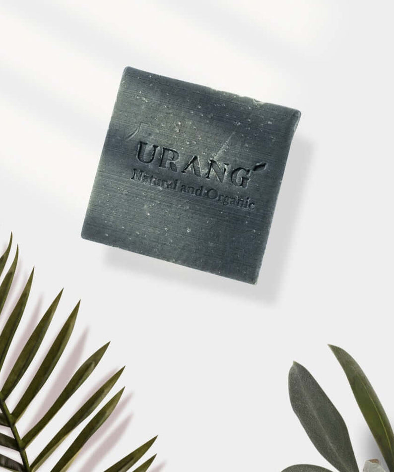 URANG Troubleshooter CP Handmade Soap with natural ingredients, square-shaped on white background with palm leaves.