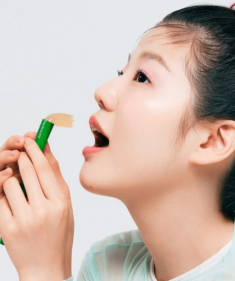 Woman enjoying VITALBEAUTIE Meta Green Calorie Cut Jelly 10 Packets