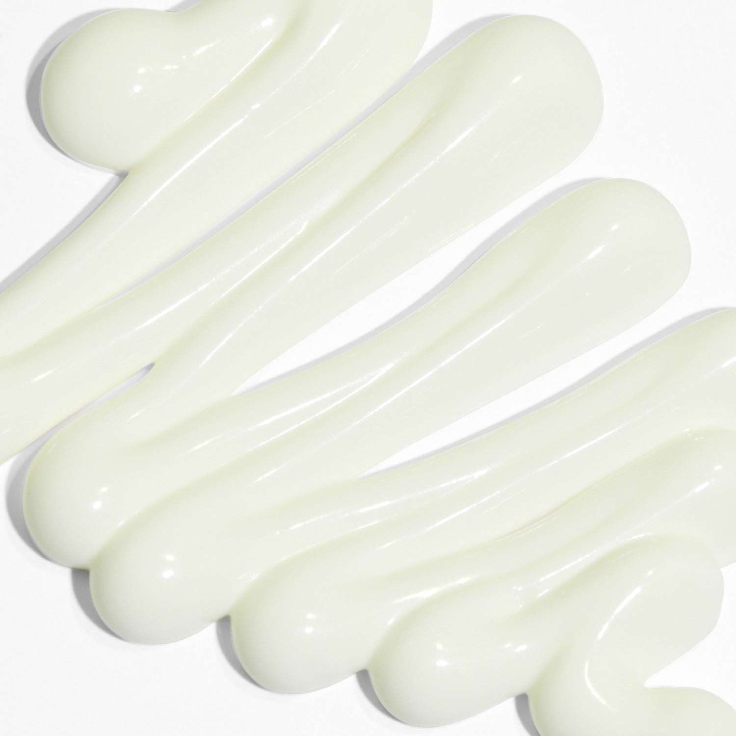 Texture of VT COSMETIC Airy Sunscreen 50ml swirled on a surface.
