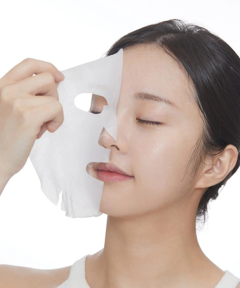 Woman applying VT COSMETIC PDRN Daily Mask 30 Sheets for skincare