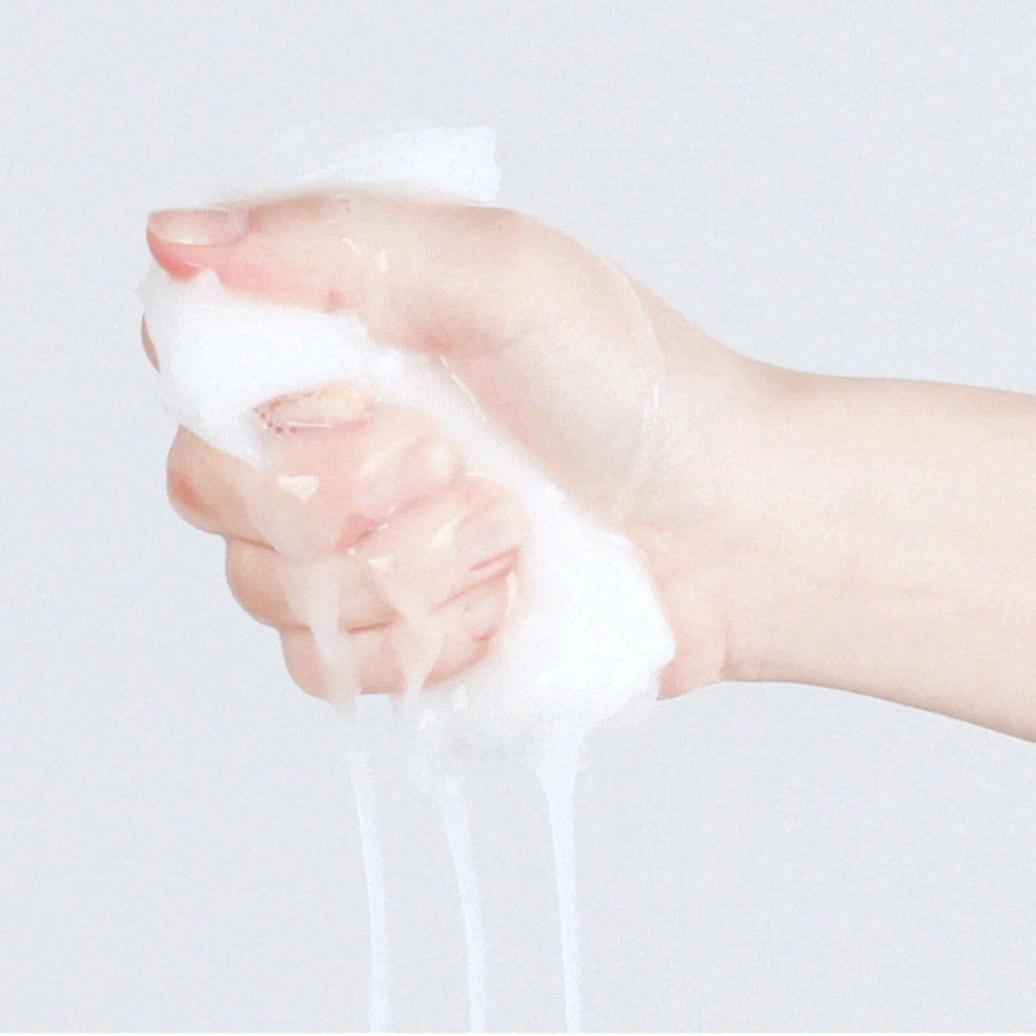 Hand squeezing foam demonstrating the texture of VT COSMETIC PDRN Daily Mask 30 Sheets.