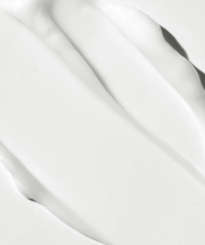 Texture of VT COSMETIC PDRN Riddle Shot Cream 50ml showcasing creamy consistency on a smooth surface