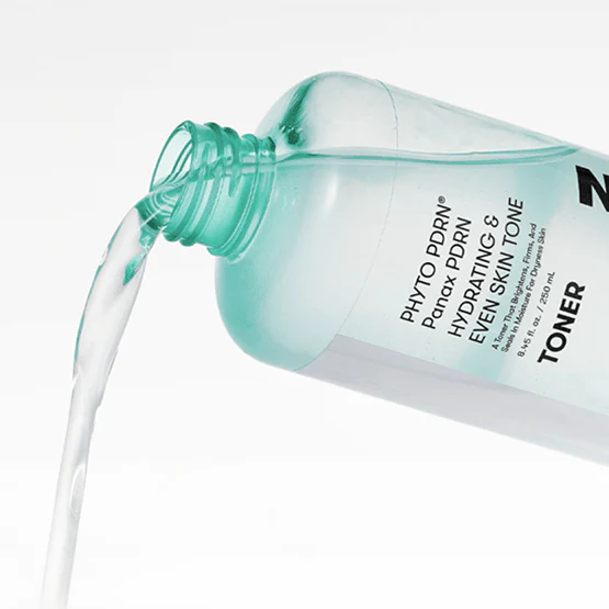 VT COSMETIC PDRN Toner 250ml being poured from a teal bottle.