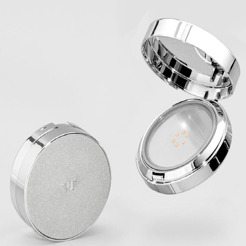 VT COSMETIC Riddle Shot Synergy Cushion 15g with open and closed case showing makeup cushion detail on a sleek, silver compact.