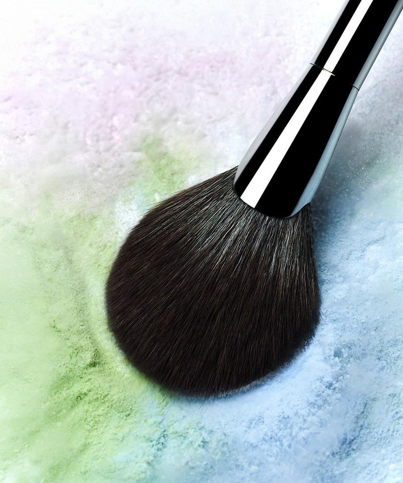 WAKE MAKE Stay Fixer Multi Color Powder 4g with makeup brush on colorful powder surface