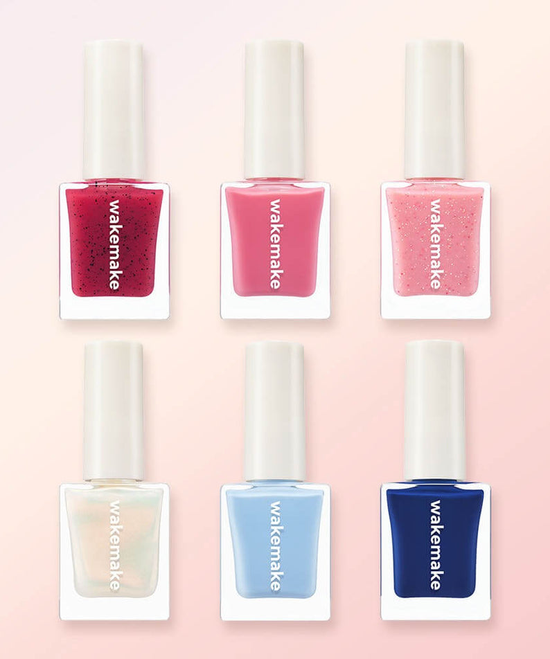 Variety of WAKEMAKE Nail Gun (#08 to #167) polish bottles in assorted colors for vibrant nail art.
