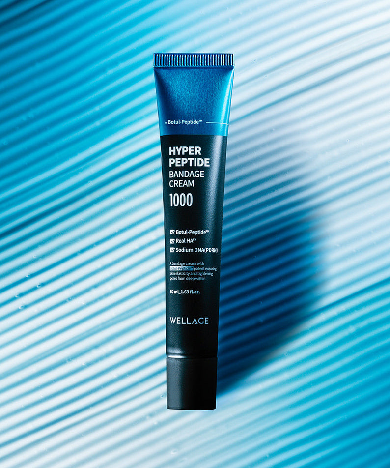 WELLAGE Hyper Peptide Bandage Cream 50ml tube on a blue textured background