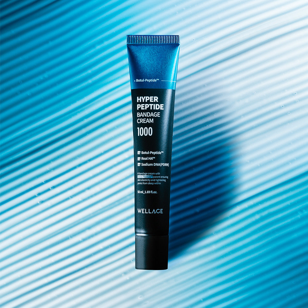 WELLAGE Hyper Peptide Bandage Cream 50ml tube on a blue textured background