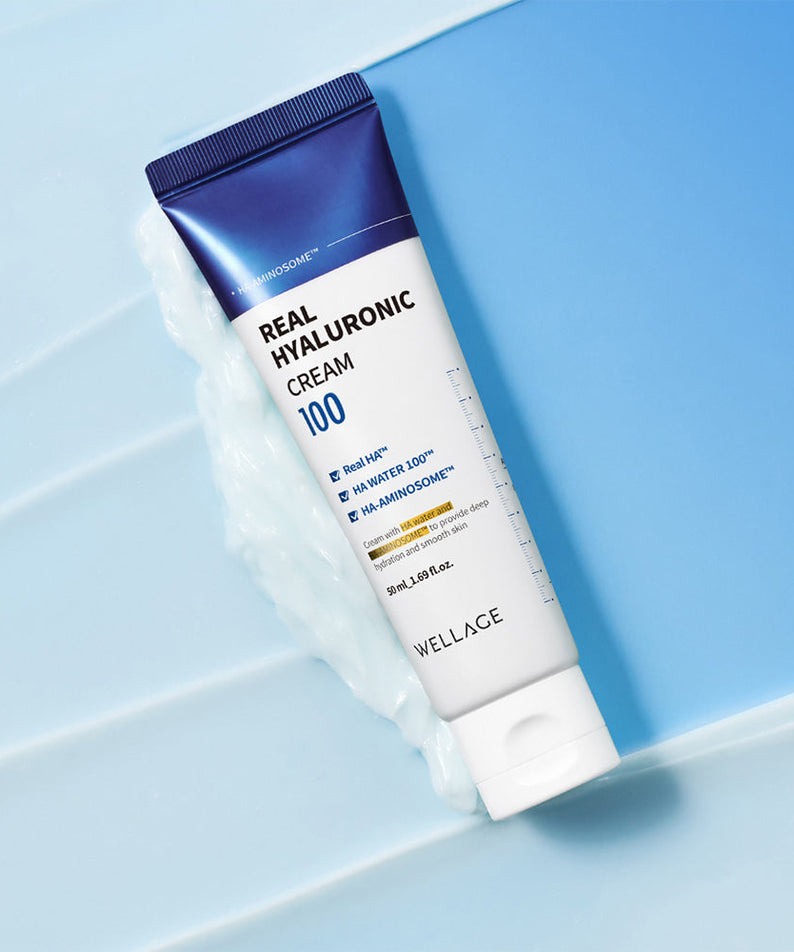 WELLAGE Real Hyaluronic 100 Cream 80ml on a blue background showcasing packaging design