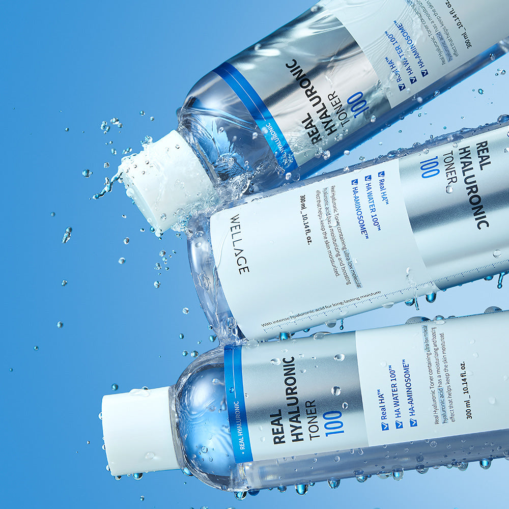 WELLAGE Real Hyaluronic 100 Toner 200ml bottles with water droplets on a blue background, showcasing skincare and hydration focus.