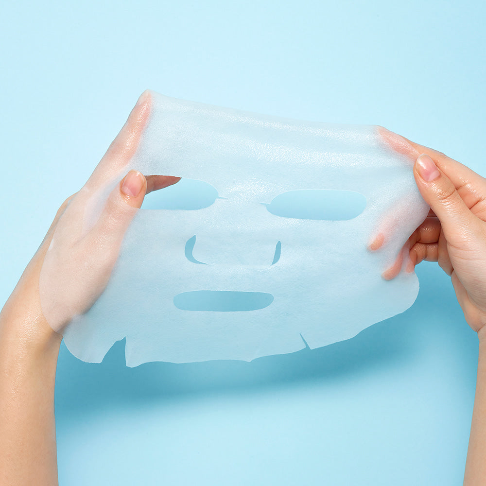 WELLAGE Real Hyaluronic Blue Ampoule Mask 5 Sheets being held against a blue background.