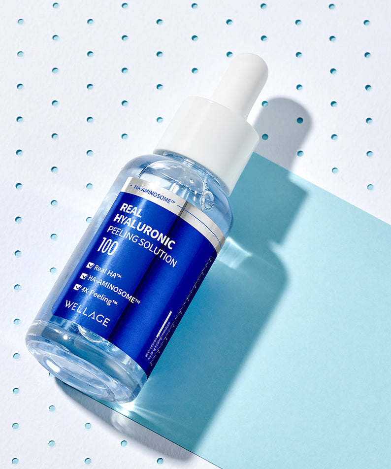 WELLAGE Real Hyaluronic Peeling Solution 30ml bottle on a blue background, skincare product, hydrating exfoliant