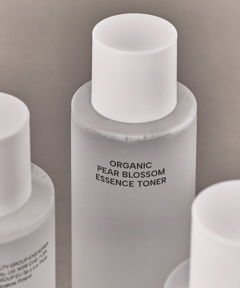 WHAMISA Organic Pear Blossom Fermented Essence Toner 160ml bottle in white, promoting natural skincare with fermented ingredients.