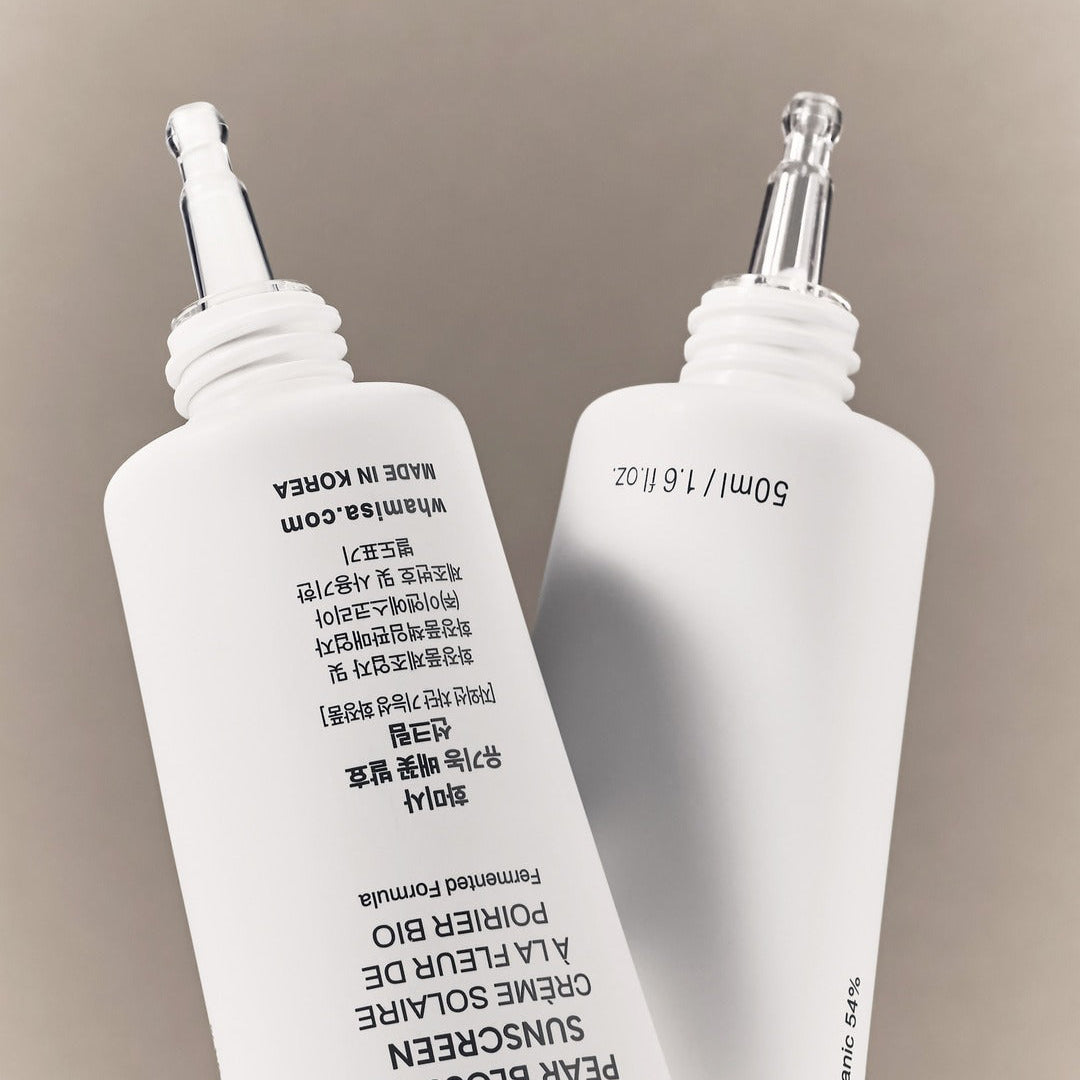 WHAMISA Organic Pear Blossom Fermented Sunscreen 50ml bottles with applicator tips