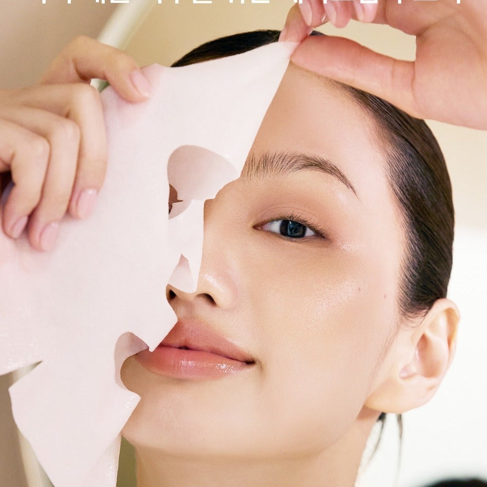 Model applying WHIPPED Butter Vegan Glow Barrier Squeeze Mask 1ea, showing skincare routine for radiant skin.