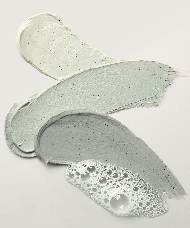 Texture swatches of WHIPPED Mugtree Vegan Cookie Clay Pack Cleanser 180ml, showcasing natural clay and foaming formula.