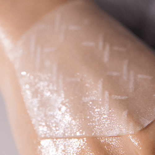 Close-up of XOUL Extreme Frozen Mask 10g on skin, showcasing texture and moisturizing effect.