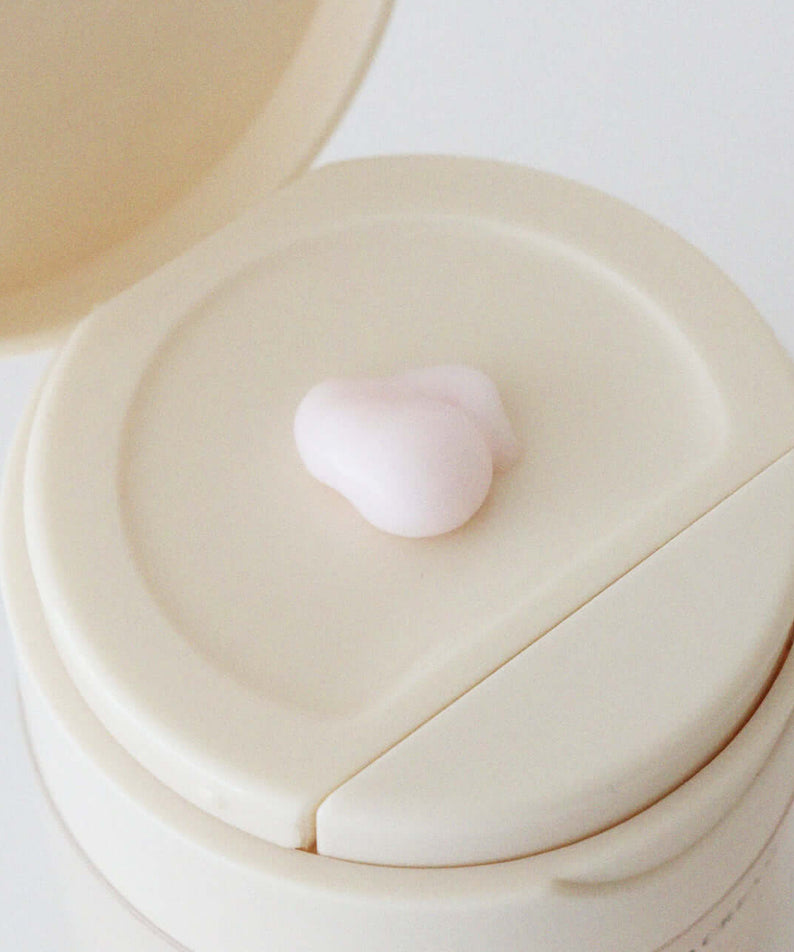 XOUL Layered Cream 50g in an open container, showing texture and packaging detail.