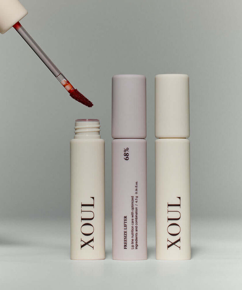 XOUL Lip Line Tattoo product displaying two lip products, one with an open applicator showing vibrant color.