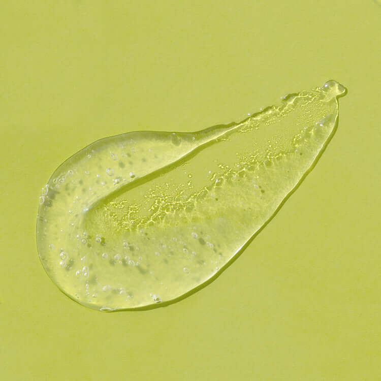 Close-up of iUNIK Lime Moisture Mild Peeling Gel 90ml texture with lime extract, on a lime green background.